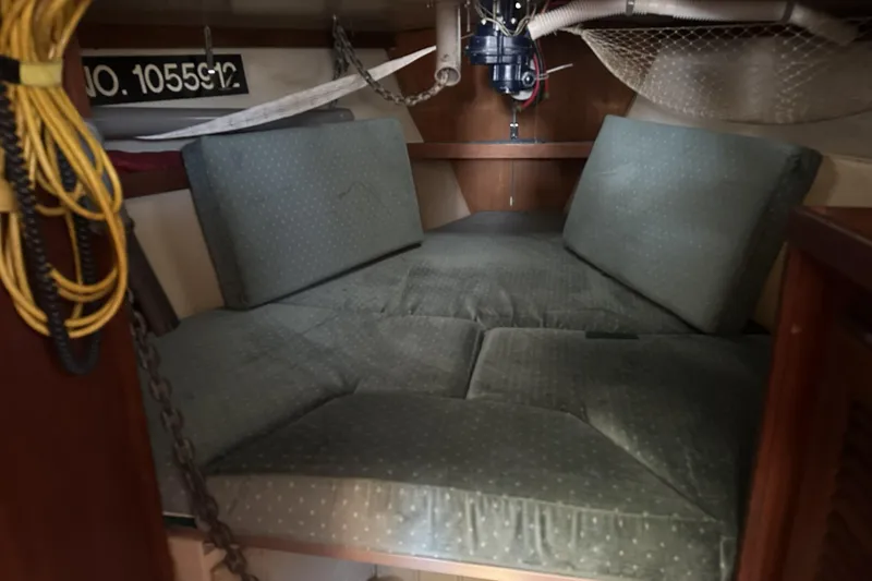 Slide: The Image of Interior cabin of a 1989 Catalina 36 MkII sailboat with cushioned seating. - 16