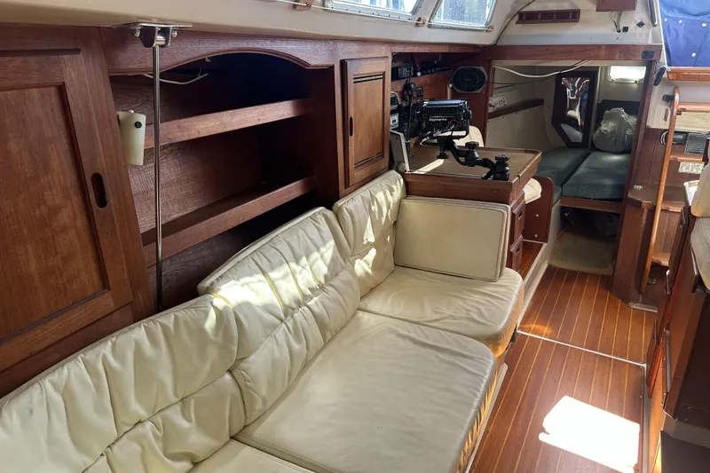 Slide: The Image of Interior of 1989 Catalina 36 MkII sailboat with wooden cabinetry and cushioned seating. - 18