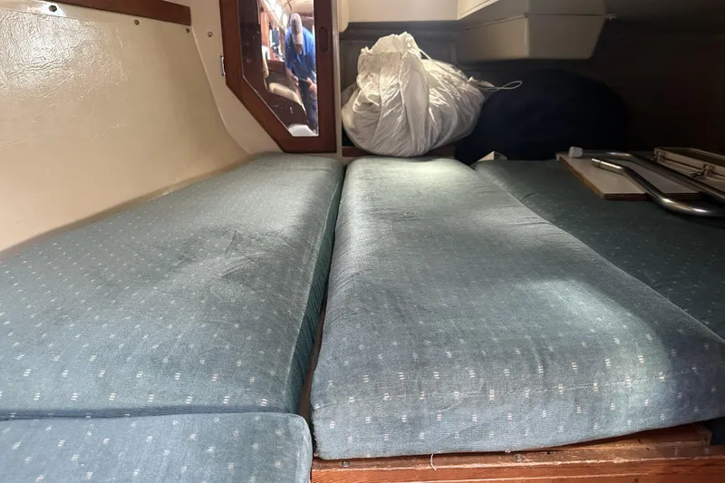 Slide: The Image of Interior cabin view of a 1989 Catalina 36 MkII sailboat with blue cushions. - 20