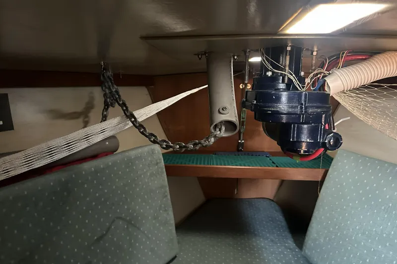 Slide: The Image of Interior of 1989 Catalina 36 MkII sailboat showing anchor chain and mechanical components. - 22