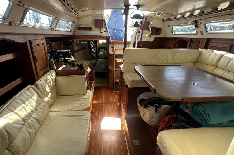 Slide: The Image of Interior of a 1989 Catalina 36 MkII sailboat with cozy seating and wooden finishes. - 23