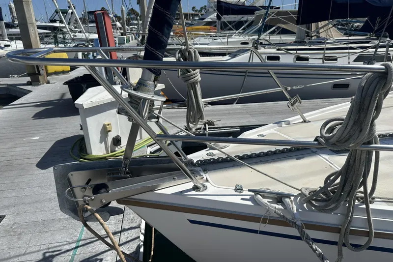 Slide: The Image of Bow of a 1989 Catalina 36 MkII sailboat docked at a marina. - 6