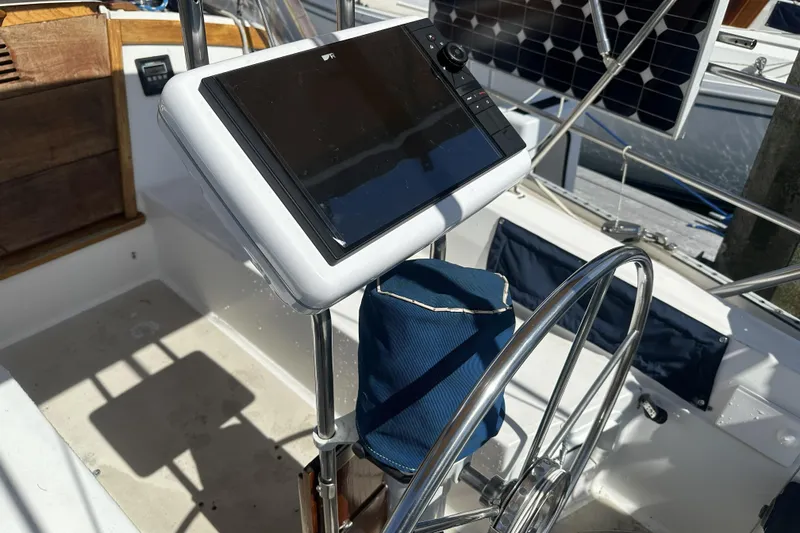 Slide: The Image of Cockpit of 1989 Catalina 36 MkII sailboat with steering wheel and navigation equipment. - 9
