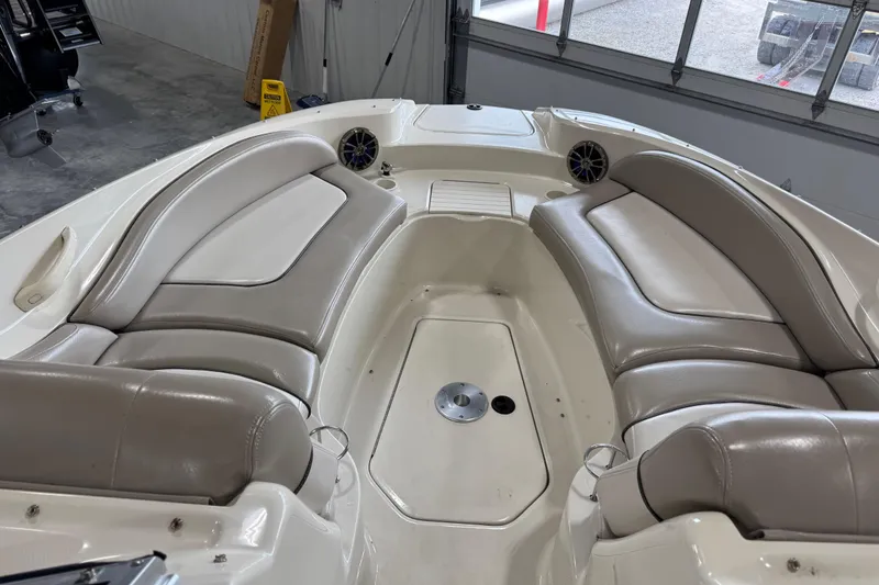 Slide: The Image of Interior view of a 2003 Sea Ray 270 Sundeck boat with beige seating. - 10