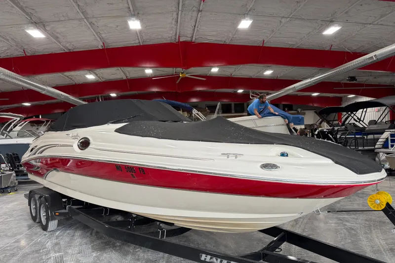 Slide: The Image of 2003 Sea Ray 270 Sundeck boat on trailer in indoor showroom. - 11