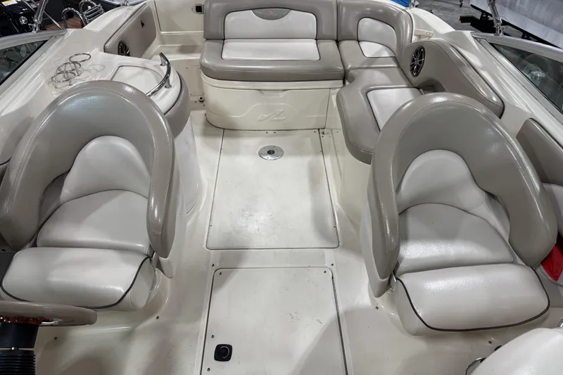 Slide: The Image of 2003 Sea Ray 270 Sundeck interior with white and gray seating arrangement. - 7