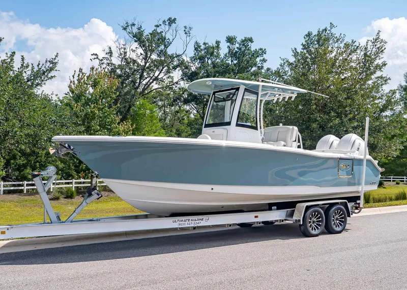 The Image of 2026 Sea Hunt Ultra 265 SE boat on trailer, side view. - 1