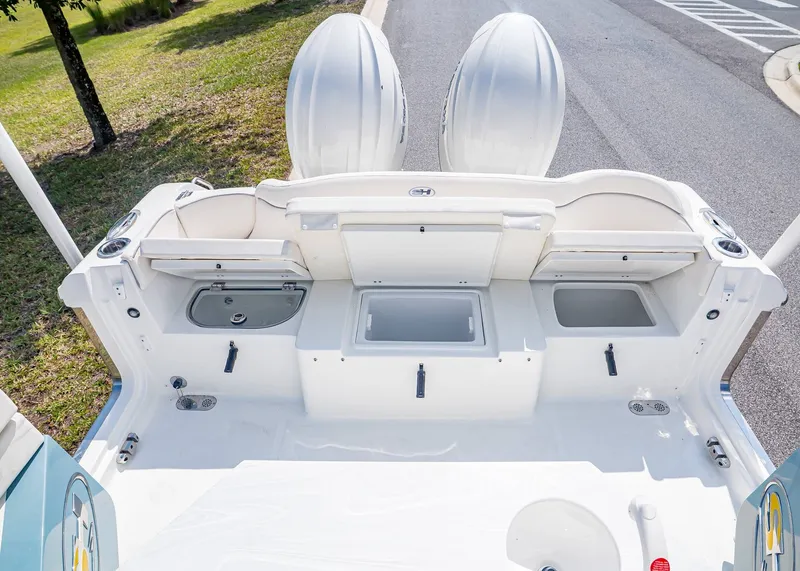 Slide: The Image of Rear view of Sea Hunt Ultra 265 SE boat, model year 2026. - 12