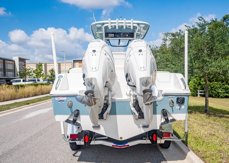 Slide: The Image of Rear view of Sea Hunt Ultra 265 SE boat, model year 2026. - 4