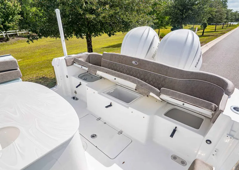 Slide: The Image of Interior of 2026 Sea Hunt ULTRA 285CB with seating and engines. - 13