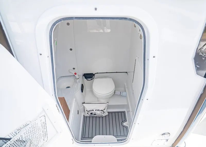 Slide: The Image of Interior of Sea Hunt ULTRA 285CB 2026 featuring a toilet. - 26