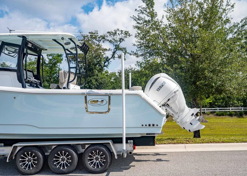 Slide: The Image of Sea Hunt ULTRA 285CB 2026 on trailer with Yamaha engine. - 3