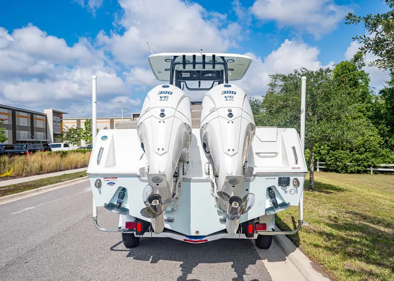 Slide: The Image of Sea Hunt ULTRA 285CB 2026 with dual outboard engines on trailer. - 5