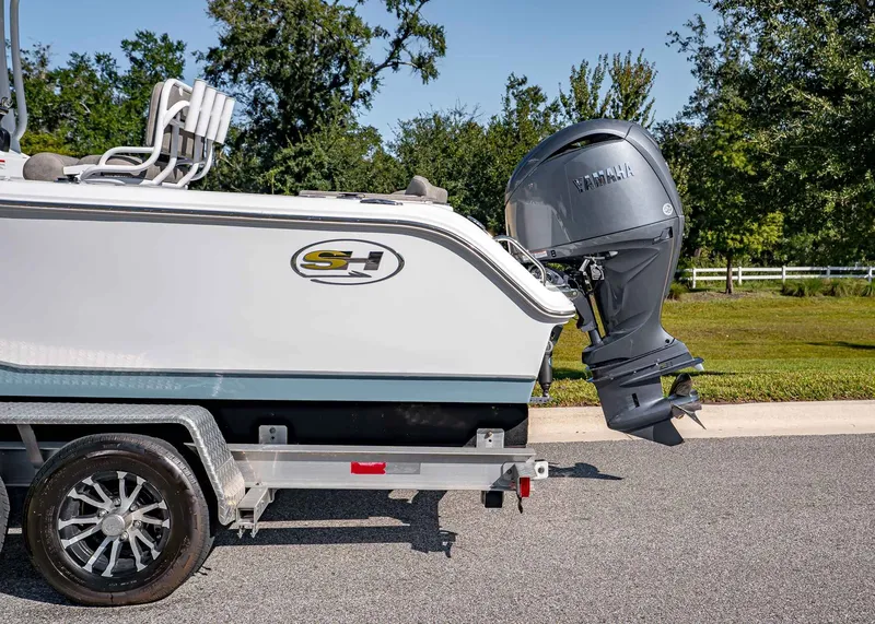 Slide: The Image of 2026 Sea Hunt Ultra 229 boat on trailer with outboard motor. - 3