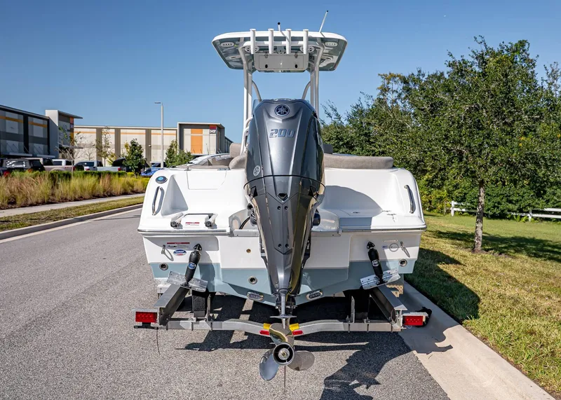 Slide: The Image of Rear view of a 2026 Sea Hunt Ultra 229 boat on a trailer. - 4