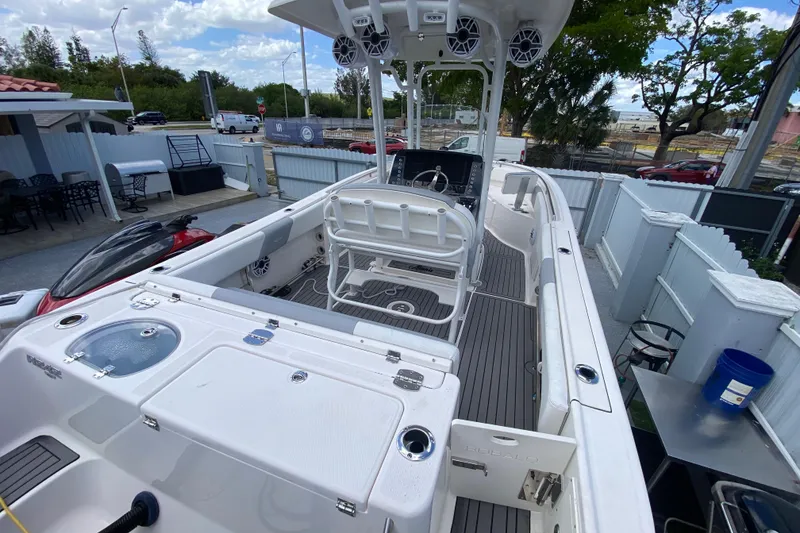 Slide: The Image of 2022 Robalo R242 Center Console boat with spacious deck and modern features. - 22