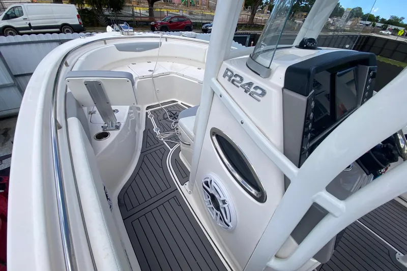 Slide: The Image of 2022 Robalo R242 Center Console boat interior with modern dashboard and seating. - 32
