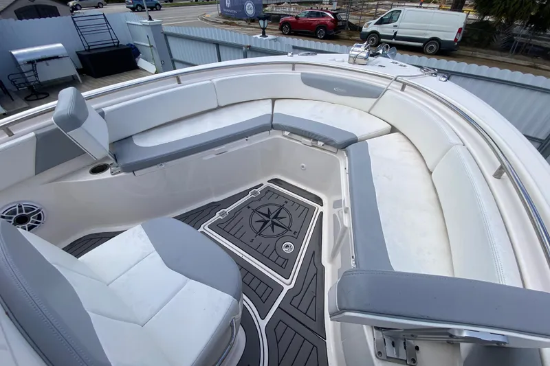 Slide: The Image of 2022 Robalo R242 Center Console boat with spacious seating and stylish deck design. - 33