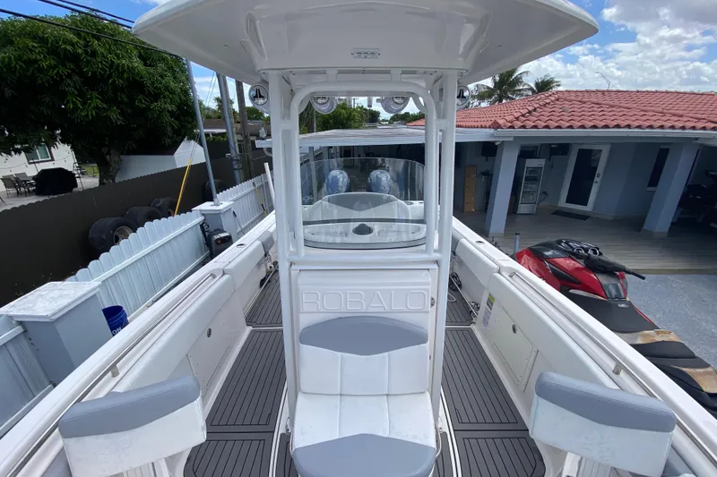 Slide: The Image of 2022 Robalo R242 Center Console boat with spacious seating and modern design. - 38