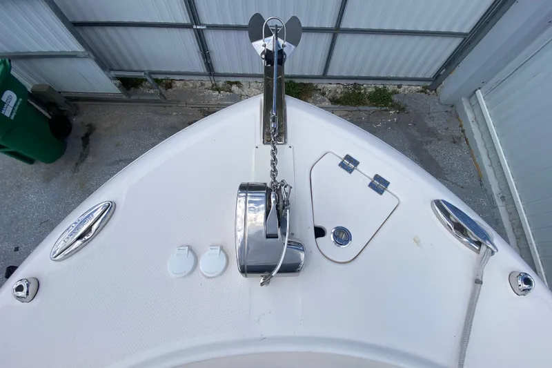 Slide: The Image of Bow of 2022 Robalo R242 Center Console with anchor and storage compartments. - 39