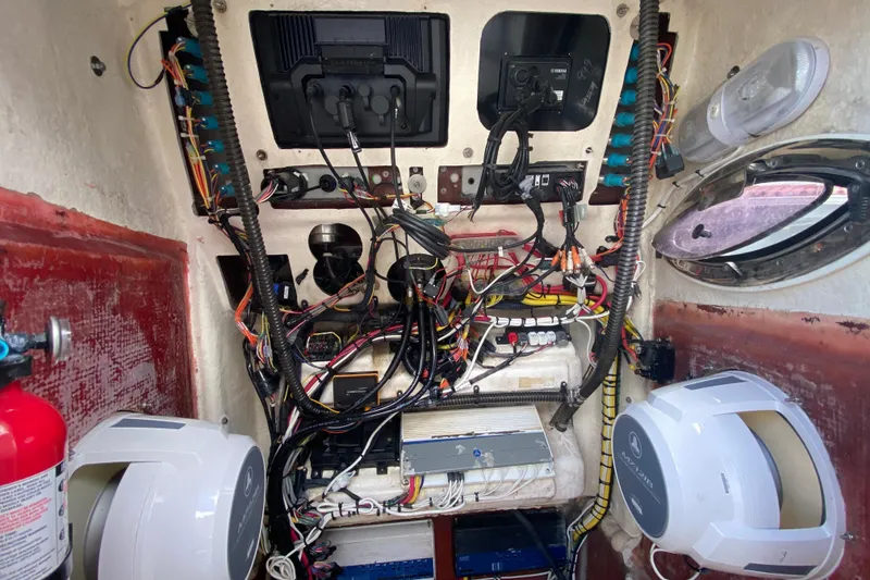 Slide: The Image of Electrical wiring and components inside a 2022 Robalo R242 Center Console boat. - 41