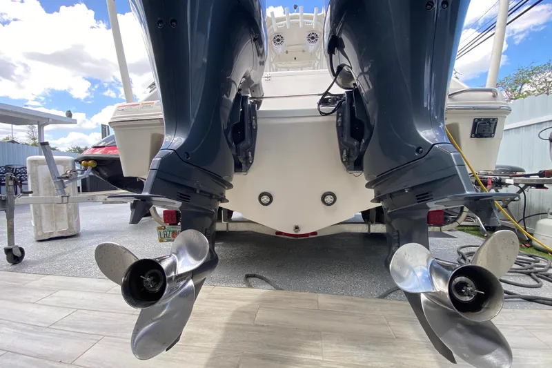 Slide: The Image of 2022 Robalo R242 Center Console boat with dual outboard motors. - 44