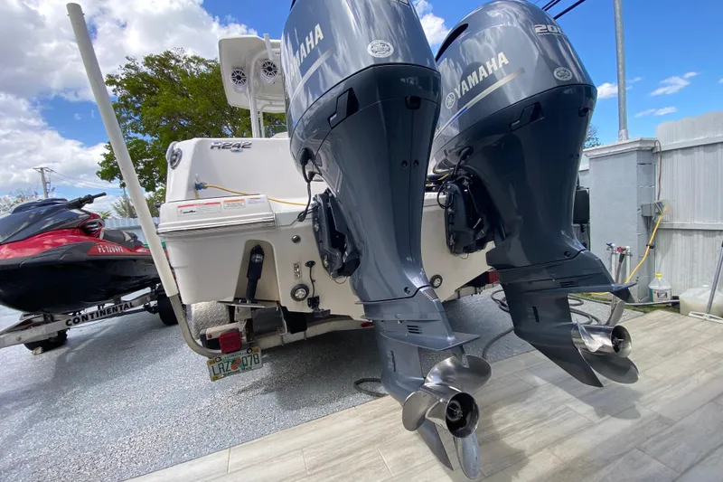 Slide: The Image of 2022 Robalo R242 Center Console with dual Yamaha outboard motors. - 45
