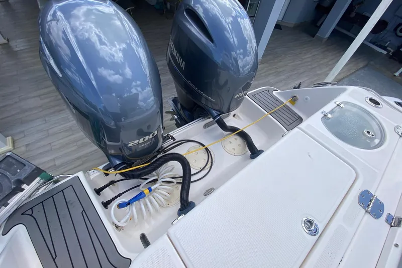 Slide: The Image of 2022 Robalo R242 Center Console with dual Yamaha outboard motors. - 48