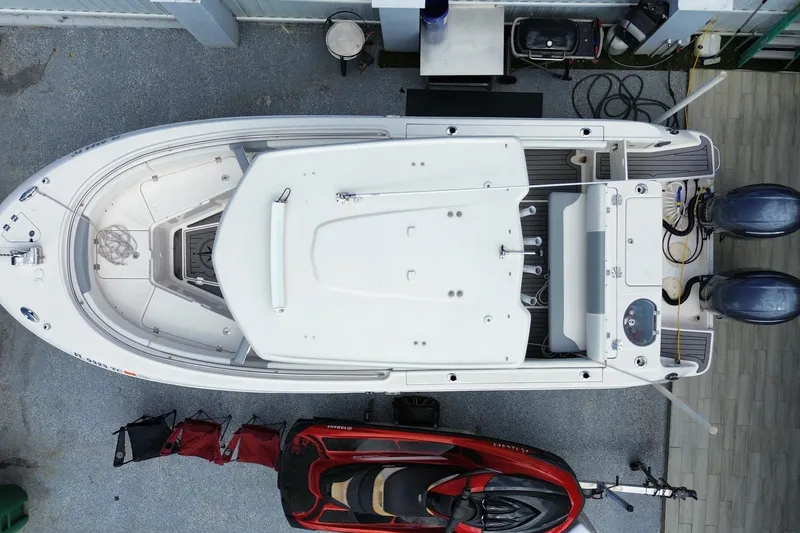 Slide: The Image of Overhead view of 2022 Robalo R242 Center Console boat docked. - 51