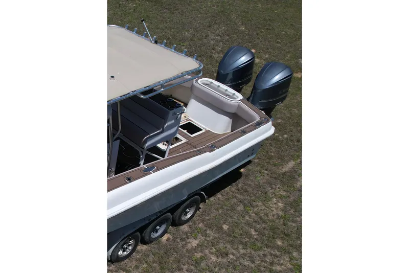 Slide: The Image of 2007 Dusky 33 Open Fisherman boat with dual outboard motors on a trailer. - 3