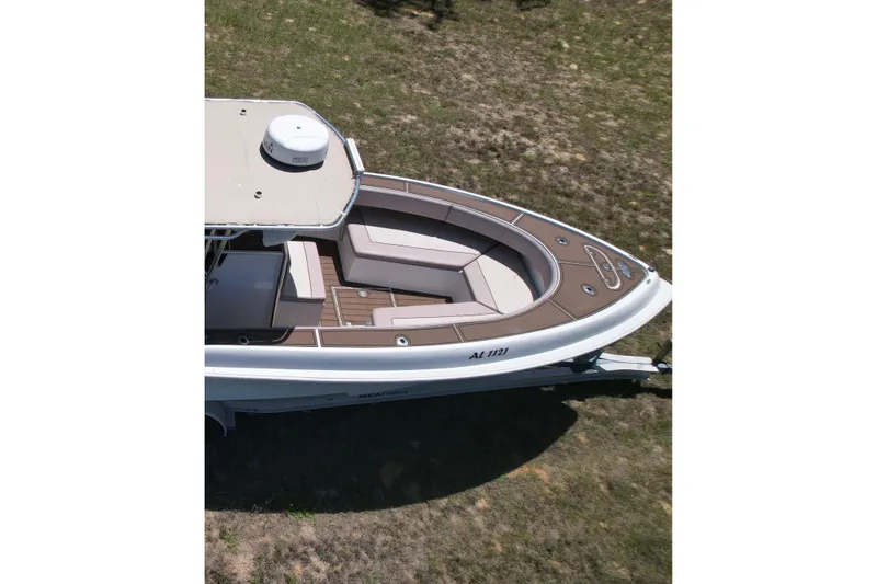Slide: The Image of 2007 Dusky 33 Open Fisherman boat with cushioned seating, viewed from above. - 4