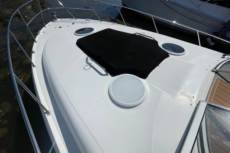 Slide: The Image of 2006 Regal Commodore 3560 IB yacht deck with black cover and railing. - 20