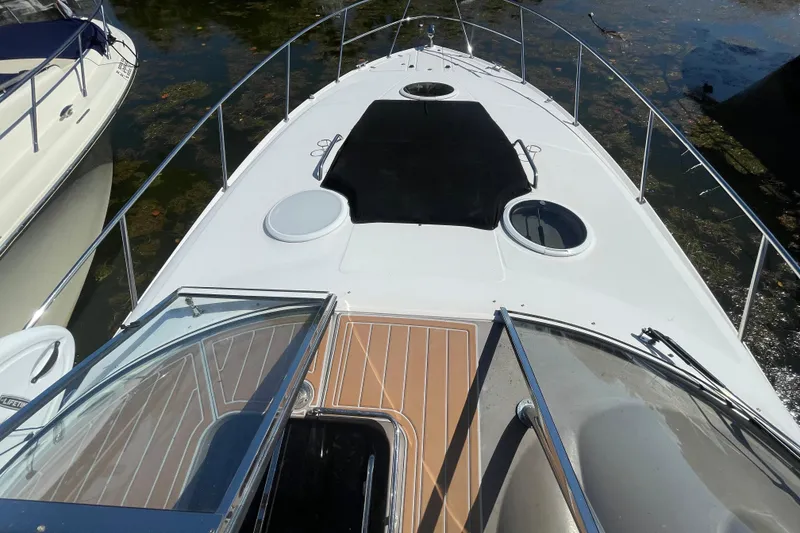 Slide: The Image of 2006 Regal Commodore 3560 IB boat deck with sleek design and spacious layout. - 22