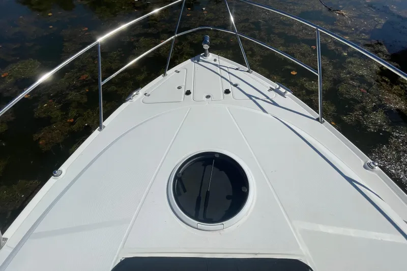 Slide: The Image of Bow of 2006 Regal Commodore 3560 IB boat with stainless steel railings. - 23