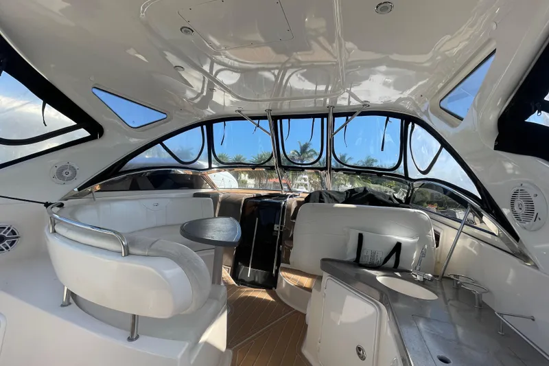 Slide: The Image of Interior of 2006 Regal Commodore 3560 IB yacht with seating and windows. - 30
