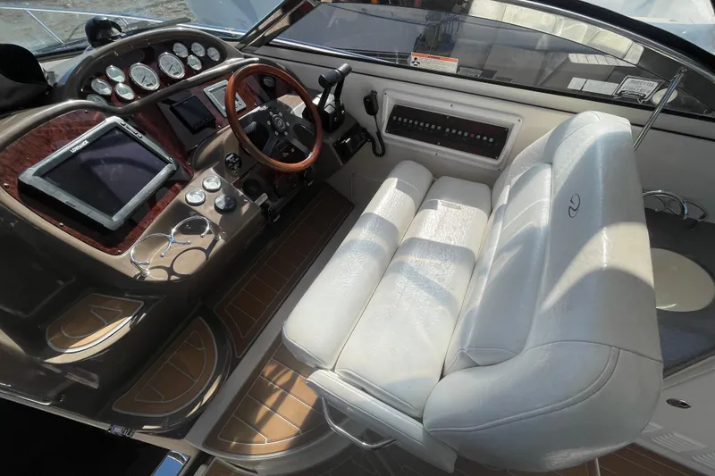 Slide: The Image of Helm of 2006 Regal Commodore 3560 IB with leather seating and modern controls. - 36