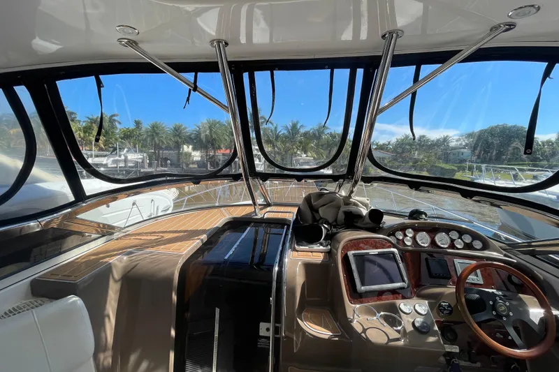 Slide: The Image of Interior view of 2006 Regal Commodore 3560 IB yacht cockpit with steering wheel and controls. - 38