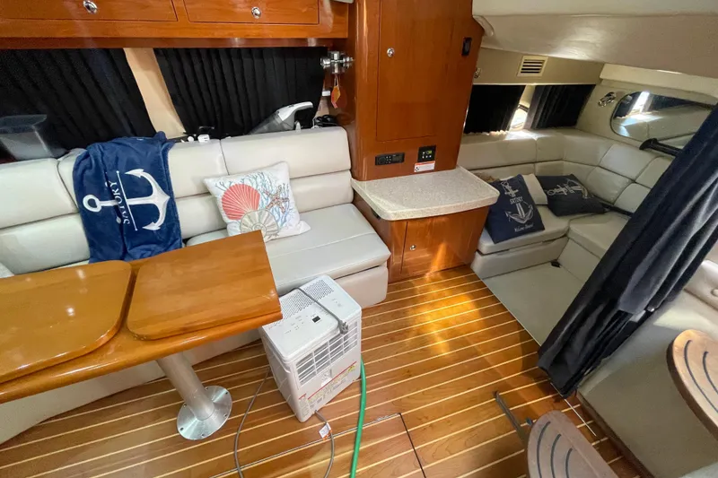 Slide: The Image of Interior of 2006 Regal Commodore 3560 IB yacht with cozy seating and nautical decor. - 45