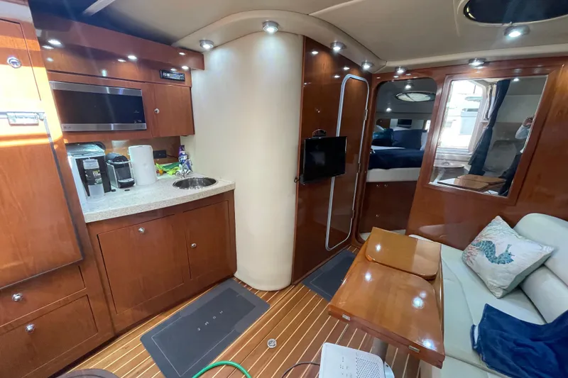 Slide: The Image of Luxurious interior of 2006 Regal Commodore 3560 IB yacht with modern amenities and elegant wood finishes. - 47