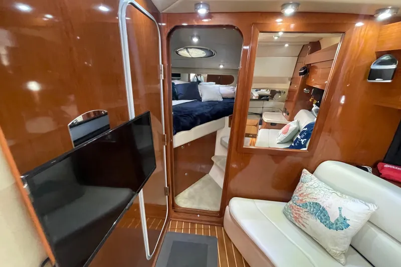 Slide: The Image of Luxurious interior of 2006 Regal Commodore 3560 IB yacht with wood finish and cozy seating. - 49