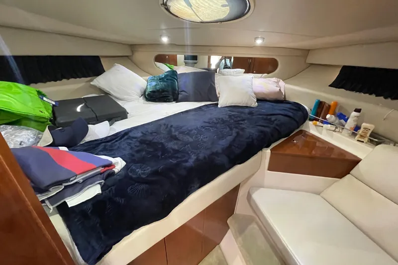 Slide: The Image of Luxurious cabin interior of 2006 Regal Commodore 3560 IB yacht with cozy bedding. - 50