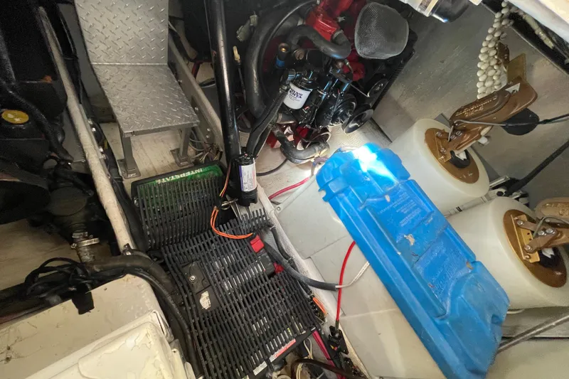 Slide: The Image of Engine room of a 2006 Regal Commodore 3560 IB boat, showing mechanical components. - 53