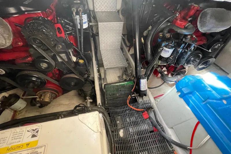 Slide: The Image of Engine compartment of a 2006 Regal Commodore 3560 IB boat, showcasing mechanical components. - 54