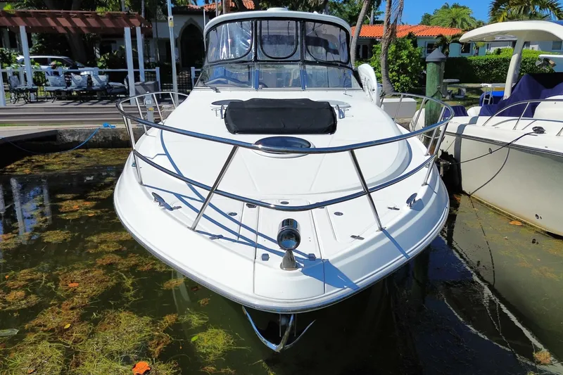 Slide: The Image of 2006 Regal Commodore 3560 IB yacht docked in a marina, front view. - 7