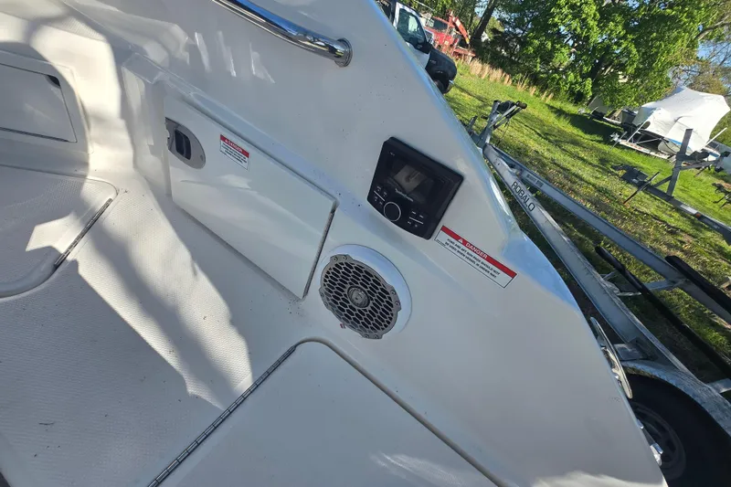 Slide: The Image of 2018 Sea Ray SDX 250 boat interior with speaker and control panel. - 13