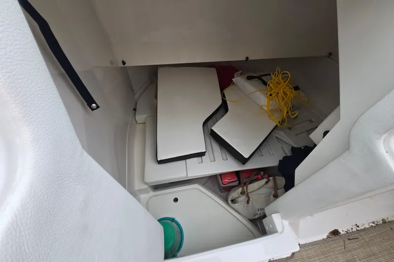 Slide: The Image of Storage compartment of 2018 Sea Ray SDX 250 boat with equipment and accessories. - 22