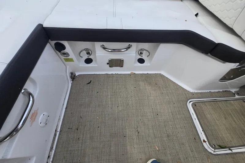 Slide: The Image of 2018 Sea Ray SDX 250 boat interior with seating and deck features. - 32
