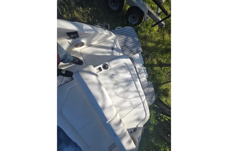 Slide: The Image of 2018 Sea Ray SDX 250 boat interior with white seating and deck. - 38