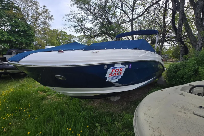 Slide: The Image of 2018 Sea Ray SDX 250 boat with blue cover, for sale sign displayed. - 42