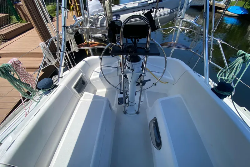 Slide: The Image of Cockpit of a 1995 Hunter 33.5 sailboat docked at a marina. - 17